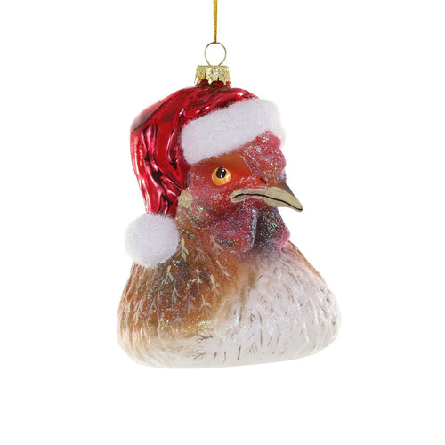 Glass chicken ornament wearing a Santa hat on a white background