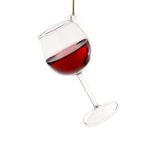 Wine glass ornament with red wine on a white background
