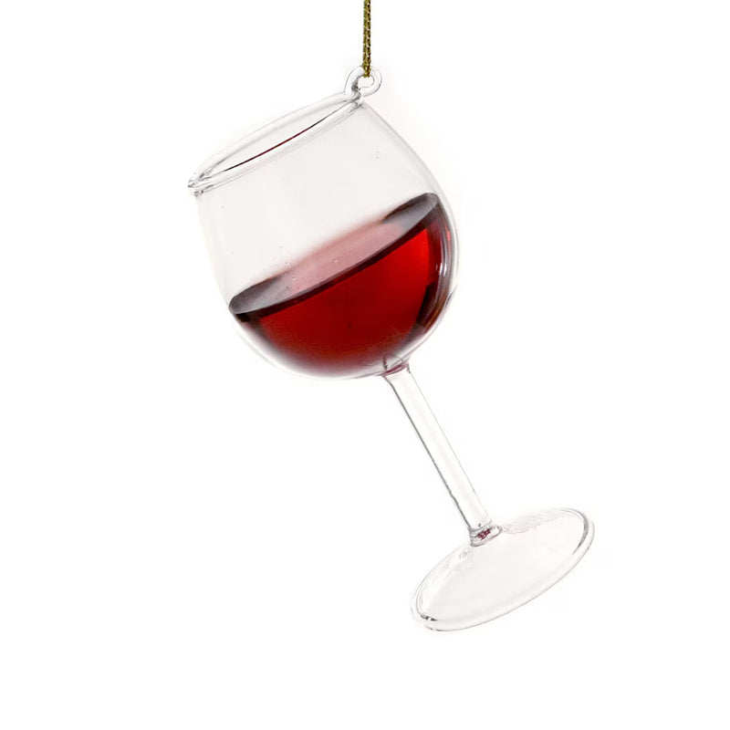 Wine glass ornament with red wine on a white background