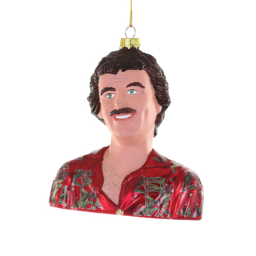 Glass ornament of a person with a mustache wearing a red shirt on a white background