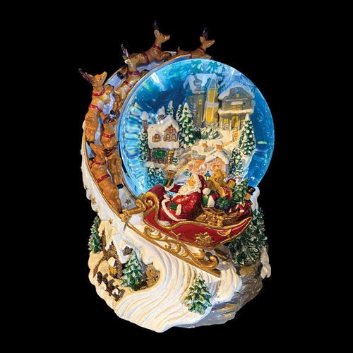 Santa In Sleigh Around Village Light Up Snow Globe - The Christmas Imaginarium